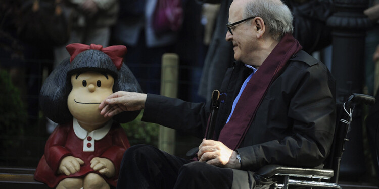 Cartoonist Joaquin Salvador Lavado, also known as Quino, touches a sculpture of his comic character Mafalda during an opening ceremony of a park of San Francisco in Oviedo, northern Spain, October 23, 2014. Quino will be awarded with the 2014 Prince of Asturias Award for Communication and Humanities at a ceremony on Friday in the Asturian capital. The Prince of Asturias Awards have been held annually since 1981 to reward scientific, technical, cultural, social and humanitarian work done by individuals, teams and institutions. REUTERS/Eloy Alonso (SPAIN - Tags: SOCIETY MEDIA ENTERTAINMENT)