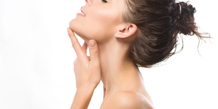 Beauty Portrait. Beautiful Spa Girl Touching her Face