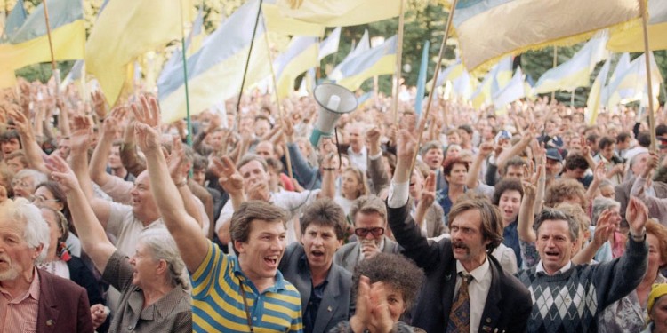 People wave Ukrainian national flags as they gather outside the parliament building in Kiev on Tuesday, Sept. 4, 1991 during a pro-independence rally. (AP Photo/Dusan Vranic)