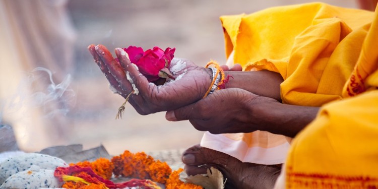 Varanasi, India - December 16, 2015 : Sacred flowers are taken for worship on hand at river Ganges, varanasi, uttar pradesh, india.
